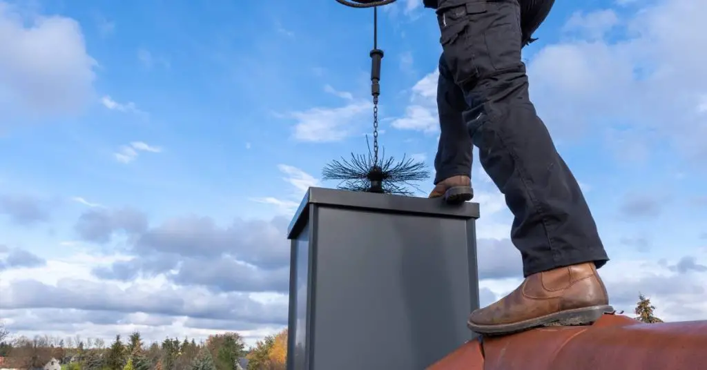 Register engineers of Ashford plumbing and heating is fitting a chimney.