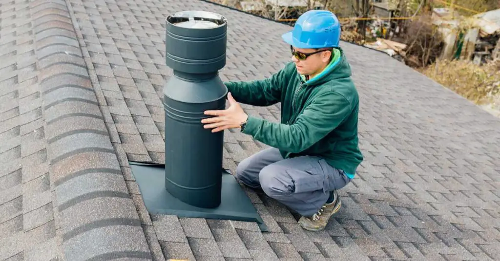 The skilled engineers at Ashford Plumbing and Heating are proficiently installing a chimney.